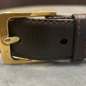 Yves Saint Laurent brown leather belt with gold buckle.